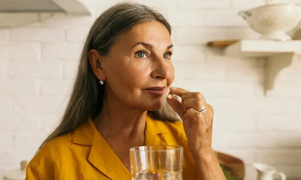 woman taking medication